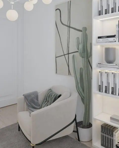 Baytur sitesi Çalışma odası okuma köşesi - tuğ mimarlık Baytur Sitesi çalışma odasında berjer, kaktüs bitkisi ve kitaplık detayı