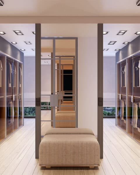 Acarkent giyinme odasında iki cepheli gardırop yerleşimi ve orta alan oturma pufu