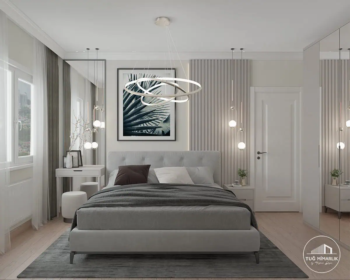 Göztepe yatak odası genel görünümü - tuğ mimarlık Göztepe yatak odasında döşemeli yatak, panel duvar, makyaj masası ve sarkıt aydınlatmalarla modern iç mimari tasarım