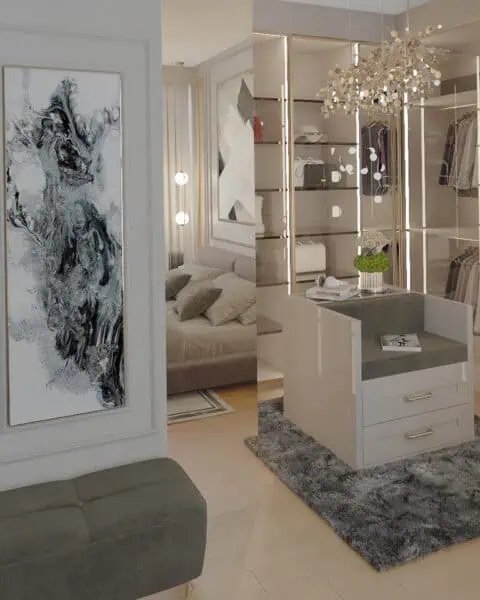 Acarkent projesinde ada şifonyer, cam dolap kapakları ve dekoratif aydınlatmalı giyinme alanı