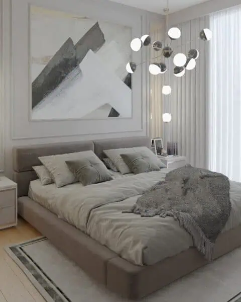 Acarkent giyinme bölümlü yatak odasında geniş yatak, büyük tablo ve modern sarkıt aydınlatma