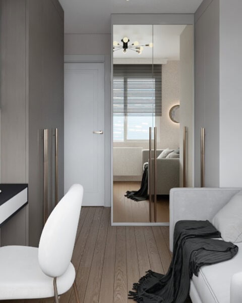 Bostancı çalışma odası projesinde çalışma masası, dolap ve oturma alanının birlikte görünümü