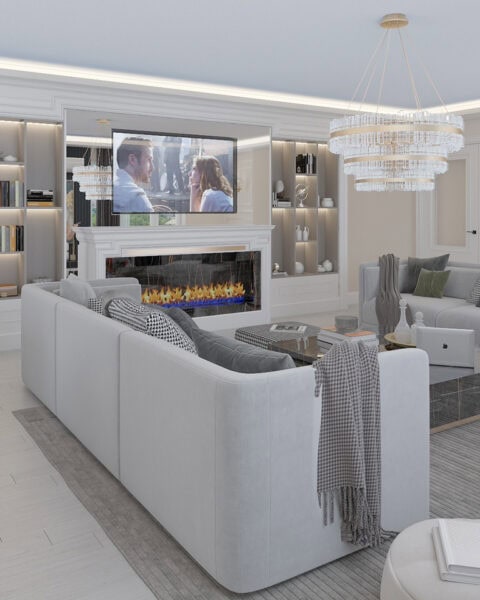 Florya salon tasarımında şömine duvarı, kristal avize ve geniş oturma alanı