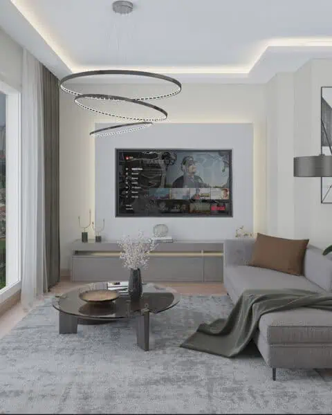 Göztepe salon tv Ünitesi ve aydınlatma - tuğ mimarlık Göztepe salonunda tv ünitesi, modern halka aydınlatma, geniş oturma alanı ve zarif iç mimari tasarım