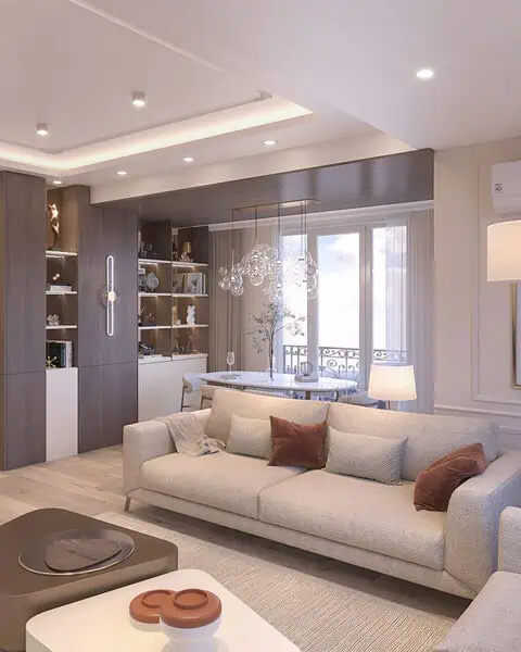 Küçükyalı salon koltuk ve yemek bölümü - tuğ mimarlık Küçükyalı salon tasarımı içinde koltuk takımı, orta sehpa, yemek alanı, ahşap kitaplık ve tavan aydınlatması