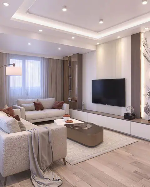 Küçükyalı salon tasarımı içinde TV duvarı, mermer görünümlü panel, koltuk grubu, özel sehpa ve aydınlatma
